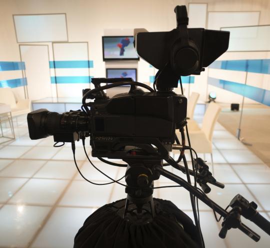 Television camera in a TV studio.