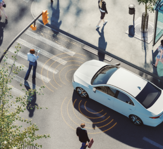 Electric vehicle at a pedestrian crossing.