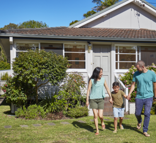 Family enjoying their time together outside their home.