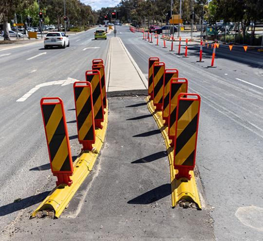 Median strip widening barrier.