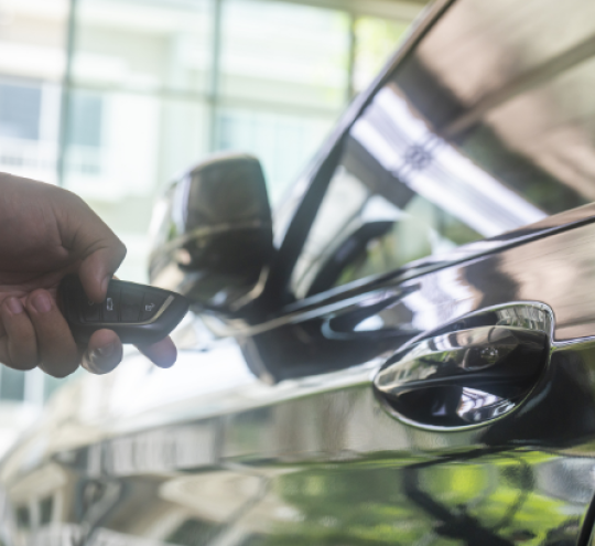 image of a person unlocking car