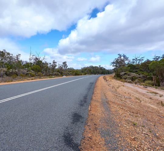 Image of a road and the shoulder.