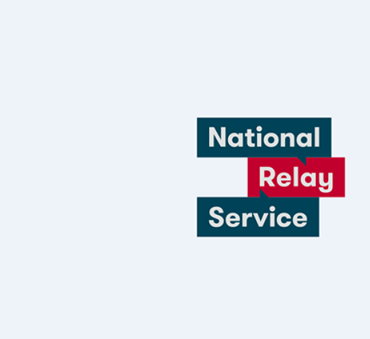 The National Relay Service logo. The logo features the words National Relay Service in red, white and navy blue.