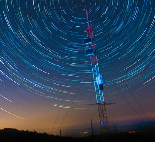 Satellite communications under a starry sky.