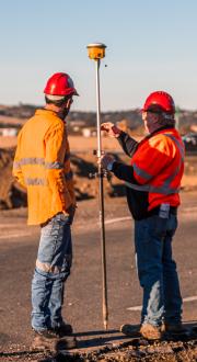 Two people doing survey work 