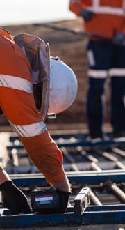 Construction workers laying the Inland Rail line