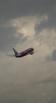 Aeroplane in the sky amongst clouds.