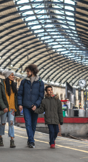 Family at a railway station. 