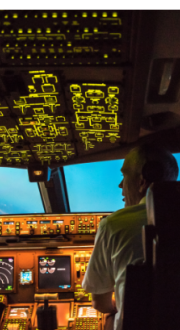 Two pilots working in the cockpit.