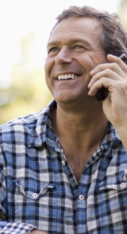 man speaking on phone outdoors