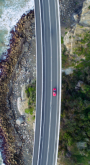 Aerial photograph of a car driving on the Sea Cliff Bridge, New South Wales