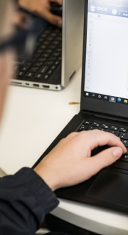 School student using a laptop.