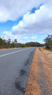 Image of a road and the shoulder.